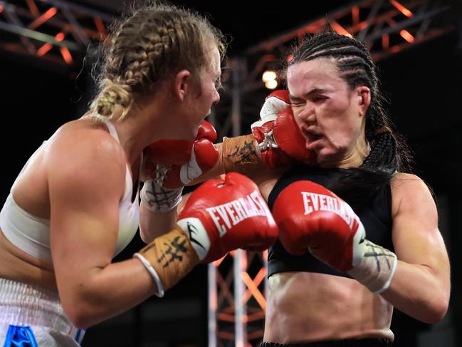 A picture showing the brutality of the sport of boxing, as Ella Boot punches Annie Thatcher in their super-lightweight bout in Sydney. Picture: Mark Evans/Getty Images