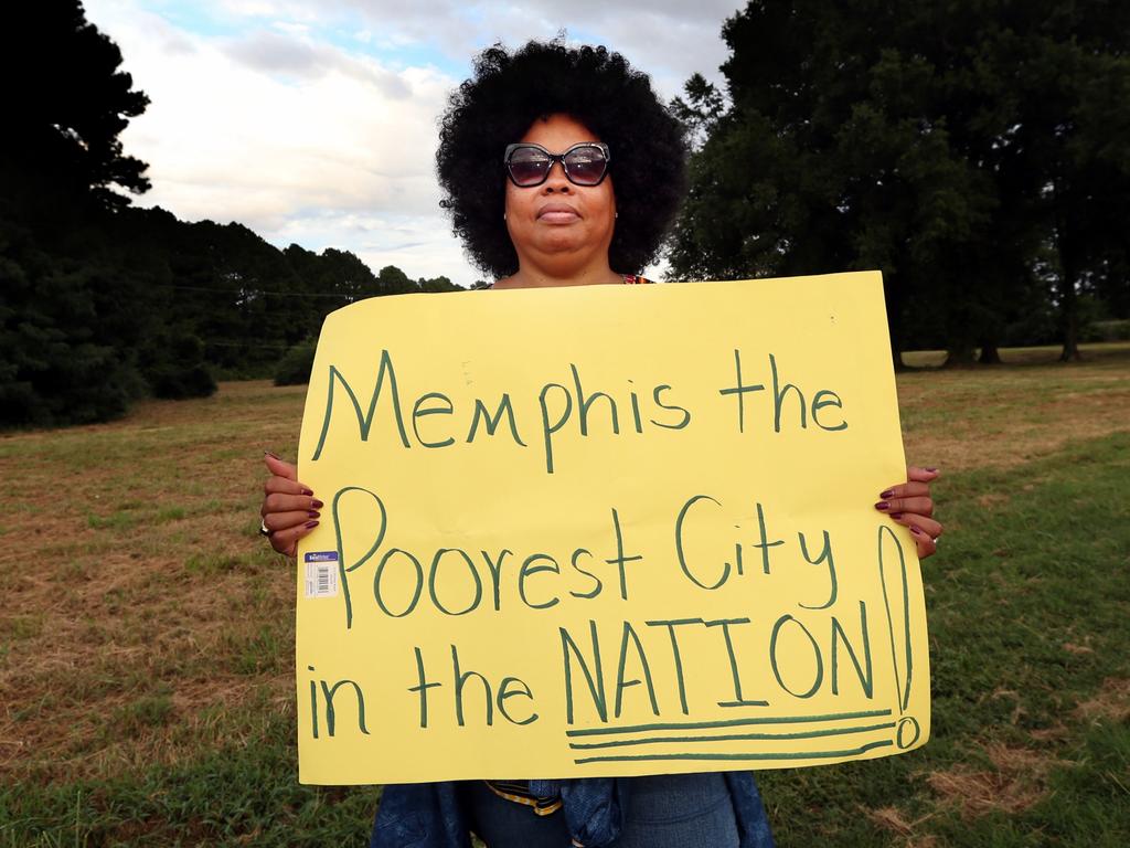 A woman highlights the problem of poverty in Memphis as the protest gets underway.