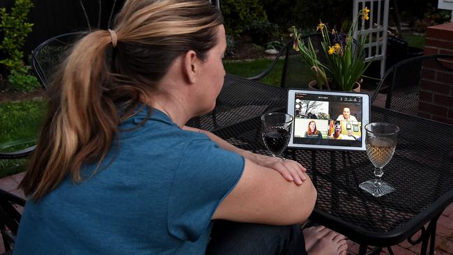 A woman enjoys a virtual happy hour during the coronavirus (Covid-19) crisis. Picture: AFP