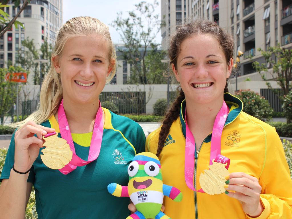 Shenae Ciesiolka and Dom du Toit show off their gold medals won in the women's Rugby Sevens at the 2014 Youth Olympics in China. Picture: Contributed