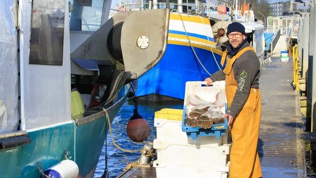 A fisherman with his catch in Boulogne-sur-Mer.