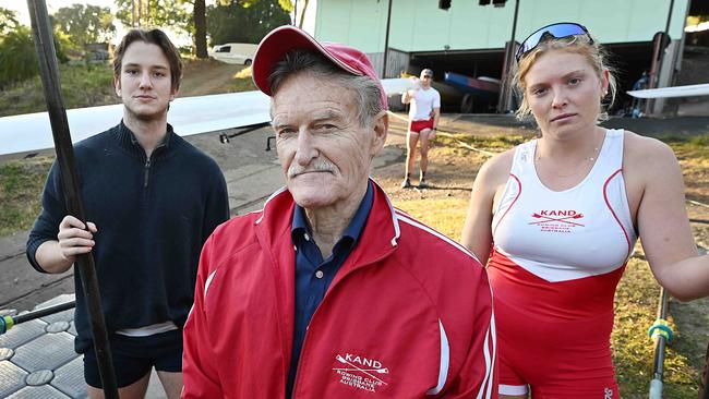 Dr Kelly Armitage flanked by rowers John Morrisey 18, and Rosie Turnbull, 20, in front of the condemned rowing shed, on Oxley Creek, Tennyson in Brisbane. One of their rowers, Logan Ulrich has just won a Silver medal in the Paris Olympics. Picture: Lyndon Mechielsen/Courier Mail