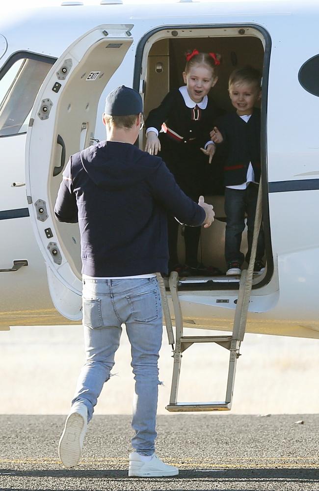 Pixie and Hunter scream as daddy walks to the plane. Picture: Stephen Cooper