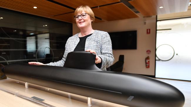 Defence Minister Linda Reynolds with a model of Australia’s French-designed submarines, the cost of which has blown out. Picture: AAP