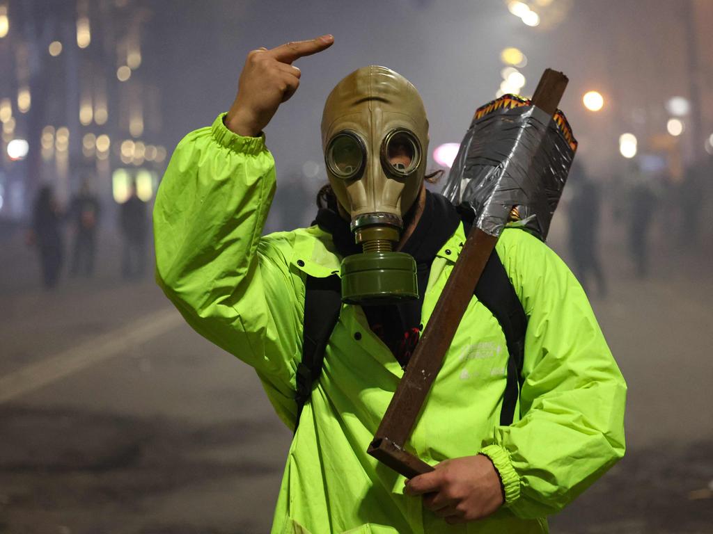 A protester covers his face with a gas mask. Picture: Giorgi ARJEVANIDZE / AFP