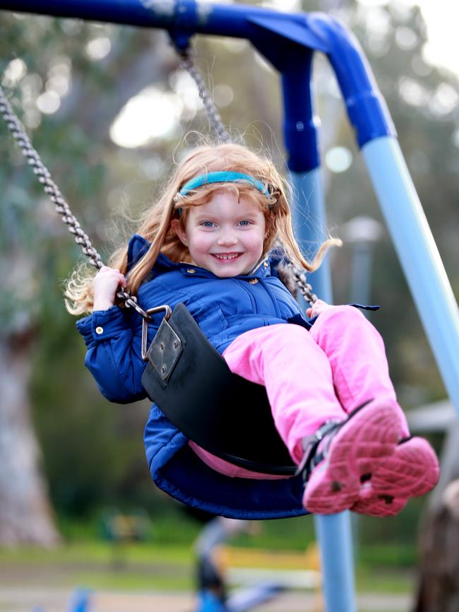 Amelia Vezis, 4, on the swing at Apex Park in Hawthorndene.