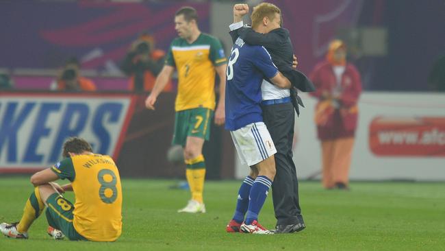 Japan coach Alberto Zaccheroni and Keisuke Honda of Japan after the 2011 final.