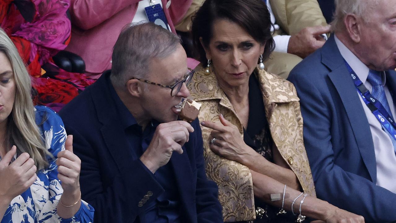 Prime Minister Anthony Albanese eats an ice cream at the men’s singles final on Sunday night. Picture: Darrian Traynor/Getty Images