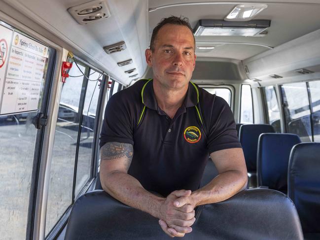 25/04/2023: Alice Springs based Yipirinya School principal Gavin Morris on the school grounds. He is with school minibuses similar to the one that was written off after a mob of students stole it in August 2022 for a joy-ride. PIC: Grenville Turner