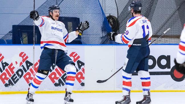 Grant Toulmin from the Ice Dogs celebrates a hat-trick while repping a special Warringah Bombers jersey in honour of the Matt Clark Charity Shield. Picture: Peter Podlaha