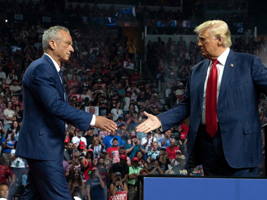 Former presidential candidate Robert F. Kennedy Jr shakes hand with Donald Trump at a rally in Arizona after backing the former US president. Picture: Getty Images via AFP