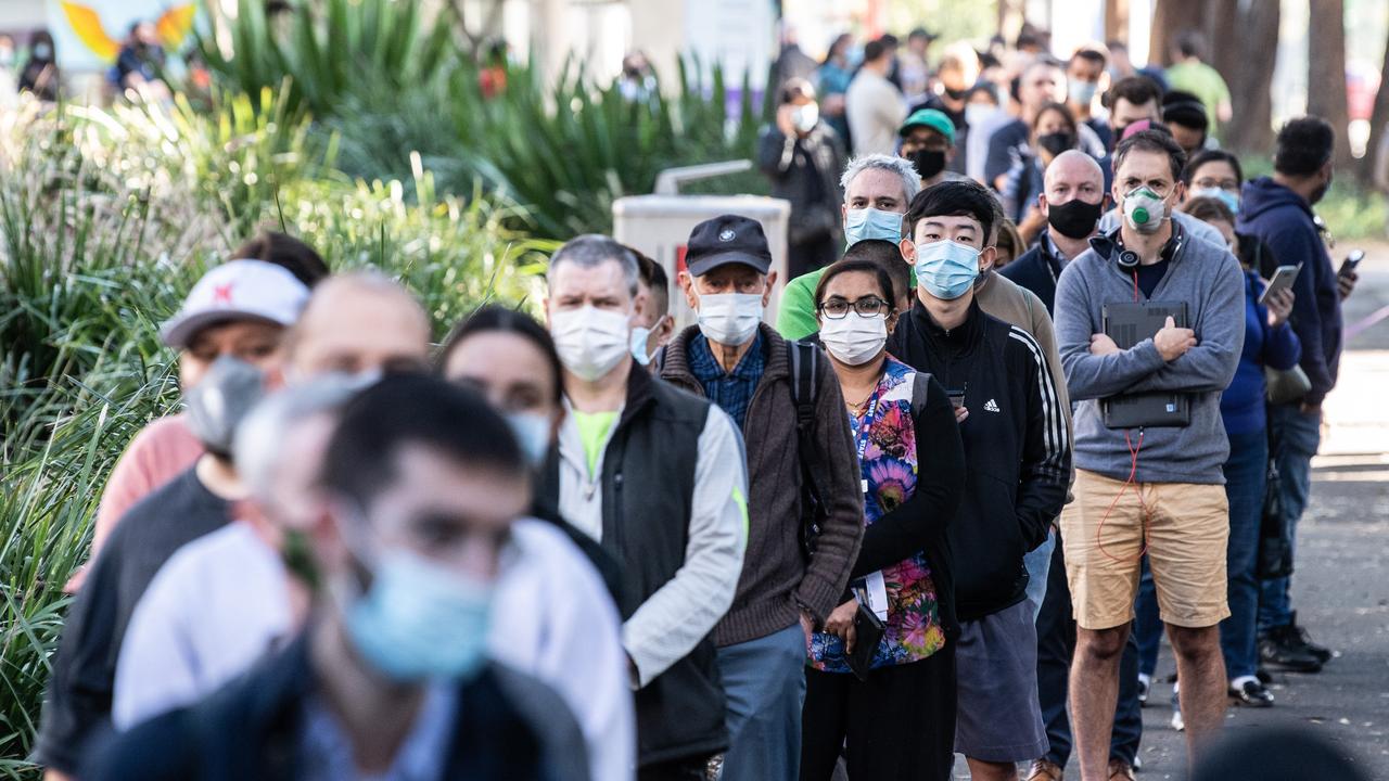 People queue to enter the NSW Vaccination Centre in Homebush, Sydney. Picture: NCA NewsWire/James Gourley