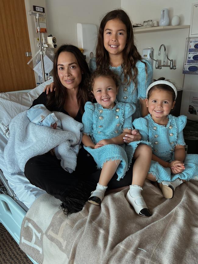 Kayla Boyd and daughters Willow, Romi, and Mia, and baby Boston, all gathered on a stunning AU$2,755 Hermes Avalon III throw blanket. Photo: Instagram.