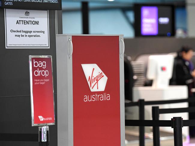 Signage for Virgin Australia is seen at Melbourne Airport in Melbourne on Monday. Picture: James Ross