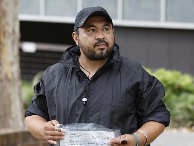 Rahmatullah Rezaei leaving Bankstown Local Court on Wednesday after facing two charges of failing to comply with reporting obligations.