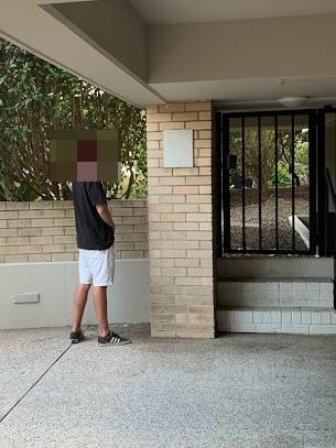 A man photographed urinating near the entrance to the Matthew Bligh apartment building. Picture: Supplied