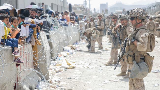 US Marines provide assistance during an evacuation at Hamid Karzai International Airport, Kabul, Afghanistan. Picture: Nicholas Guevara/US Marine Corps/AFP