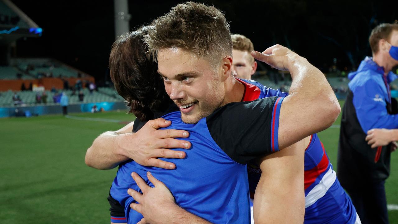 Josh Schache embraces Luke Beveridge after he played an important role negating Port Adelaide interceptor Aliir Aliir in the Bulldogs’ 2021 preliminary final triumph. Picture: Michael Willson / Getty Images