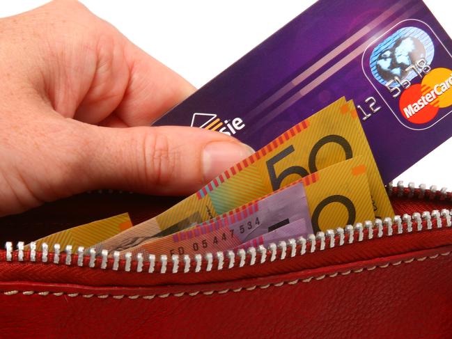 Generic Mastercard images. Mastercard credit card and money being pulled out of a wallet. Purse.