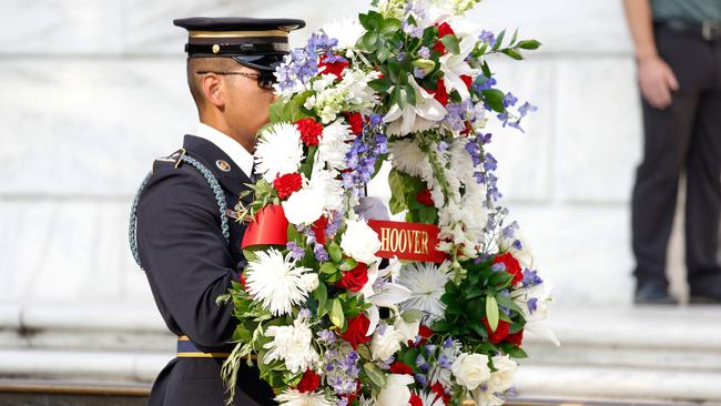 A military officer carrying a wreath during the event Mr Trump attended. Picture: Anna Moneymaker/Getty Images via AFP