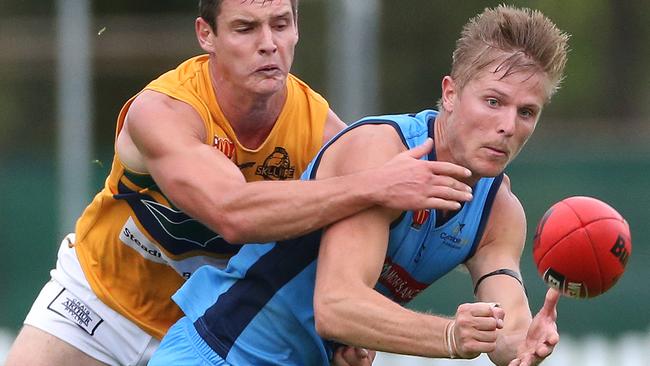 Kory Beard handballs under pressure from Eagles’ Luke Thompson. He has been a dominant force for Marble Range in recent years. Picture: Stephen Laffer