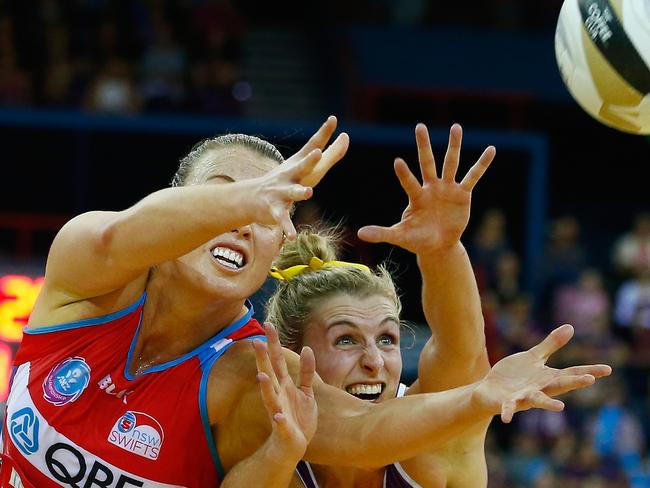 BRISBANE, AUSTRALIA - JULY 31: Gabi Simpson of the Firebirds competes for the ball with Kimberlee Green of the swifts during the 2016 ANZ Championship Grand Final match between the Queensland Firebirds and the NSW Swifts at Brisbane Entertainment Centre on July 31, 2016 in Brisbane, Australia. (Photo by Jason O'Brien/Getty Images)