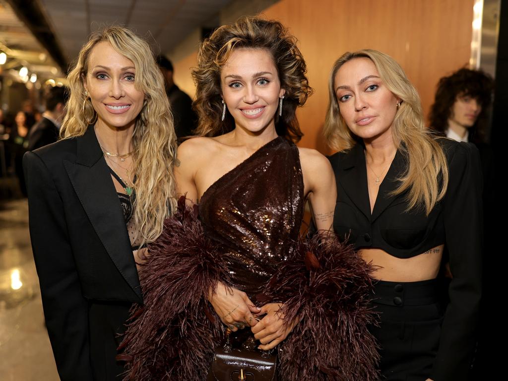 Miley prefers to surround herself with family, including mum Tish and sister Brandi. Picture: Neilson Barnard/Getty Images