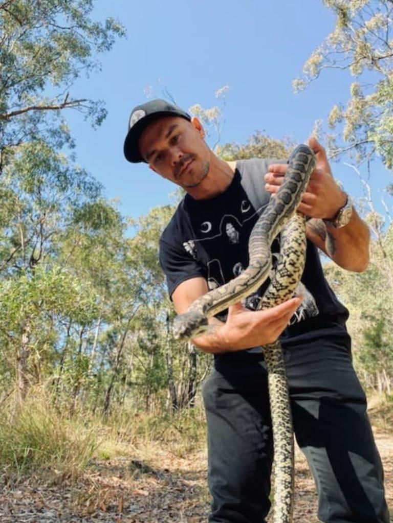 Australian Man Sitting On Toilet Spots Enormous Python Lounging Atop Shower