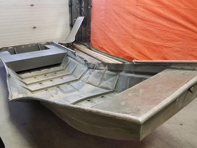 A damaged aluminium boat found on the shore of the Nelson River believed to have been used by Kam McLeod and Bryer Schmegelsky. Picture: Supplied