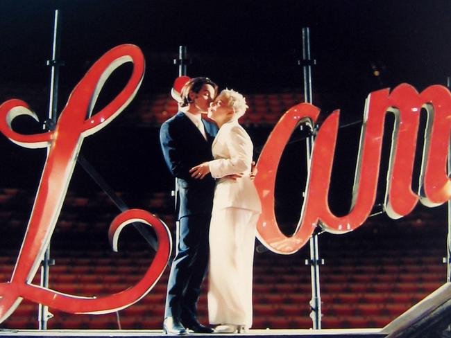 Baz Luhrmann and Catherine Martin kiss on the occasion of their wedding at the Opera House.