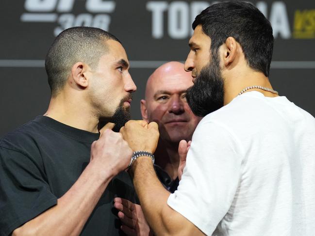 ABU DHABI, UNITED ARAB EMIRATES - OCTOBER 24: (L-R) Opponents Robert Whittaker of New Zealand and Khamzat Chimaev of Russia face off during the UFC 308 press conference at Etihad Arena on October 24, 2024 in Abu Dhabi, United Arab Emirates.  (Photo by Chris Unger/Zuffa LLC)