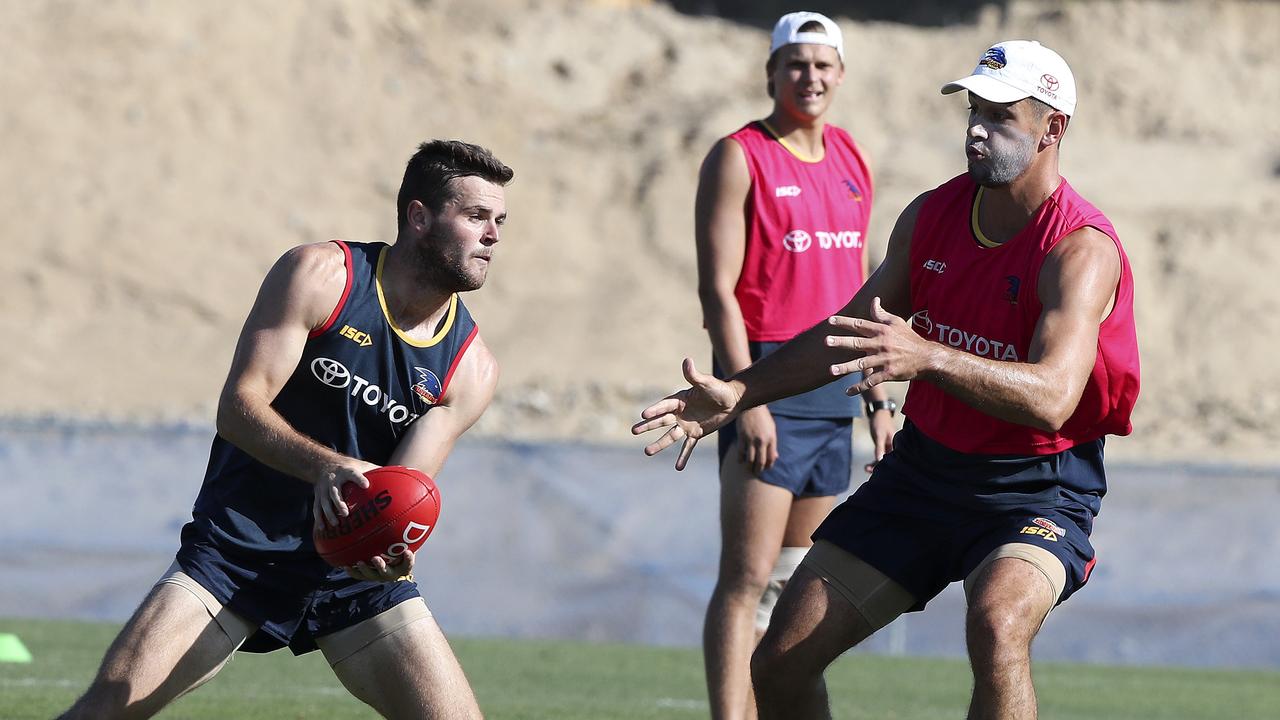 Brad Crouch evades Taylor Walker at training on Thursday. Picture Sarah Reed