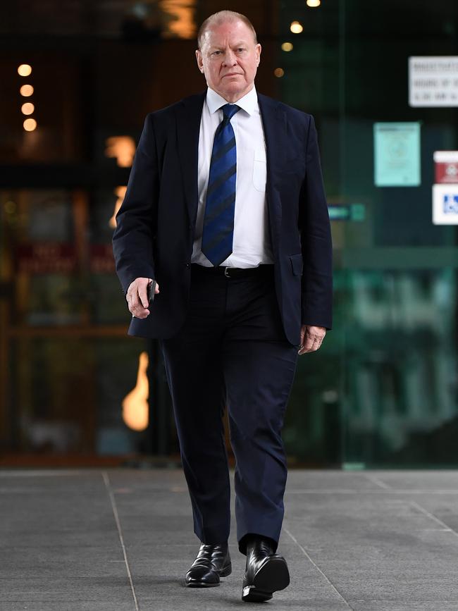 Gold Coast Titans chairman Dennis Watt leaves the Coroner's court in Brisbane. Picture: Dan Peled