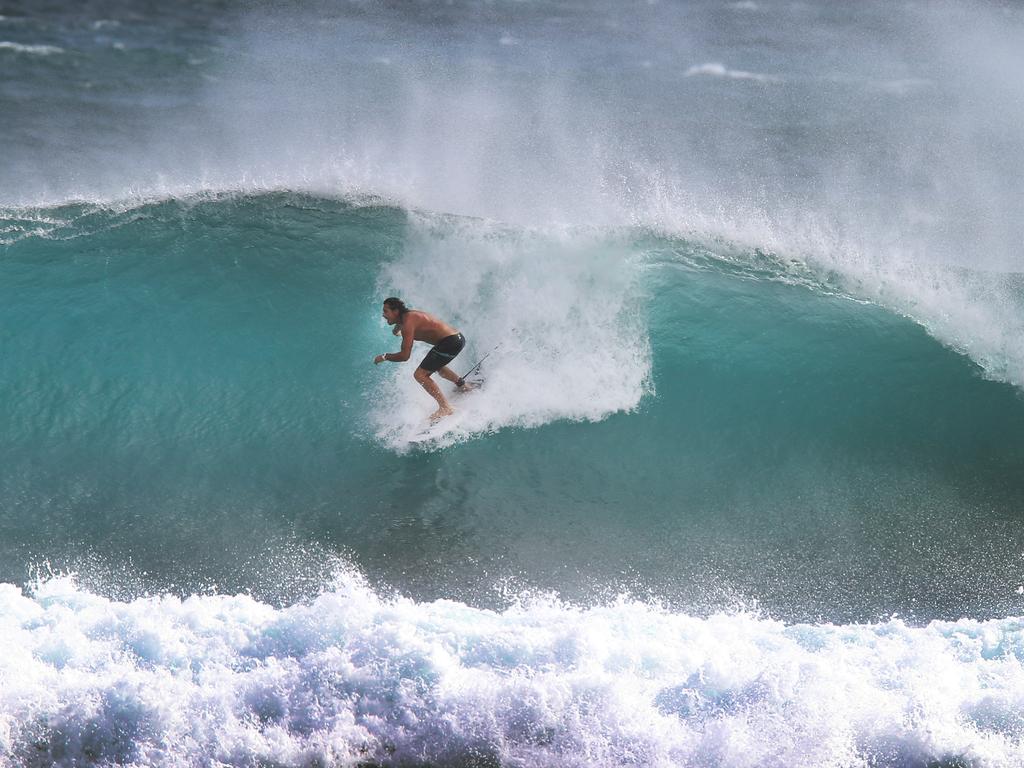 Surfers enjoy huge waves at Kirra Beach. Picture: Glenn Hampson