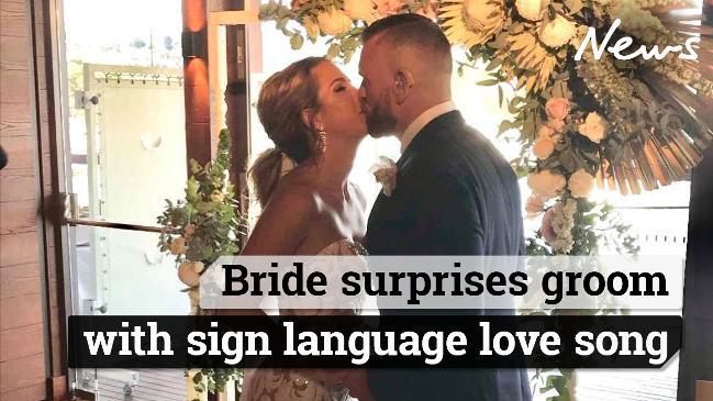 Bride surprises groom with sign language love song