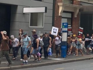 Protesters in a Brisbane "Freedom Rally" march through the CBD. Picture: Danielle O'Neal