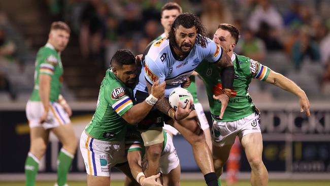 CANBERRA, AUSTRALIA - OCTOBER 03:  Andrew Fifita of the Sharks is tackled during the NRL Elimination Final match between the Canberra Raiders and the Cronulla Sharks at GIO Stadium on October 03, 2020 in Canberra, Australia. (Photo by Mark Kolbe/Getty Images)