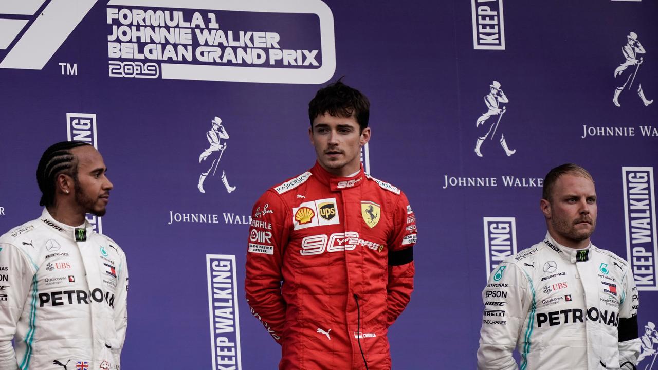 Winner Charles Leclerc (C), Lewis Hamilton (L) and Valtteri Bottas (R) on the podium.