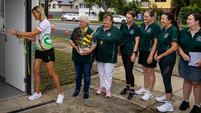 Catherine Cox opens the doors at the clubhouse reopening.