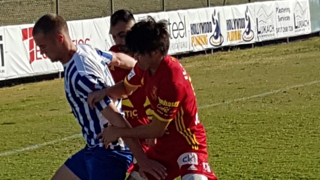 Preston Lions players battle for possession against Yarraville Glory. Picture: Tim Michell.