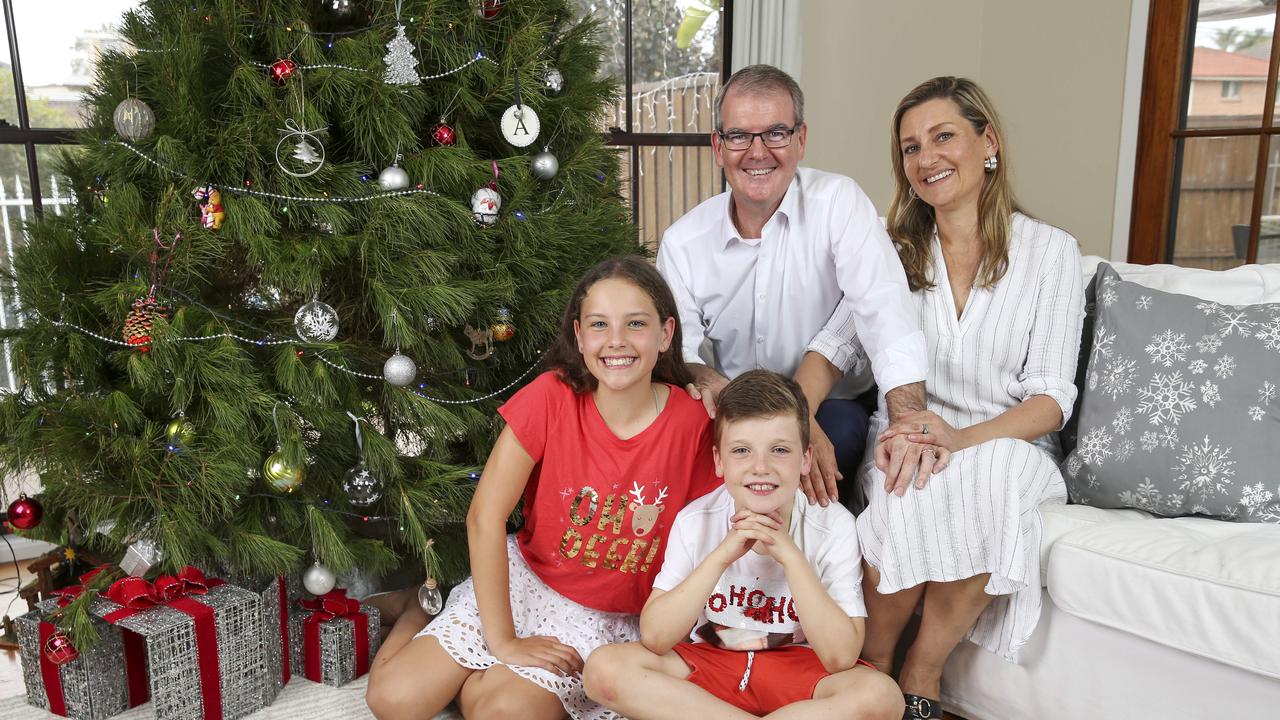 Michael Daley at home with his wife Christina and children Olivia, 12, and Austen, 8. Picture: Justin Lloyd 