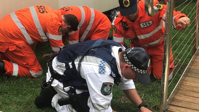 Police search Lismore Base Hospital as part of the investigation of the fatal shooting.