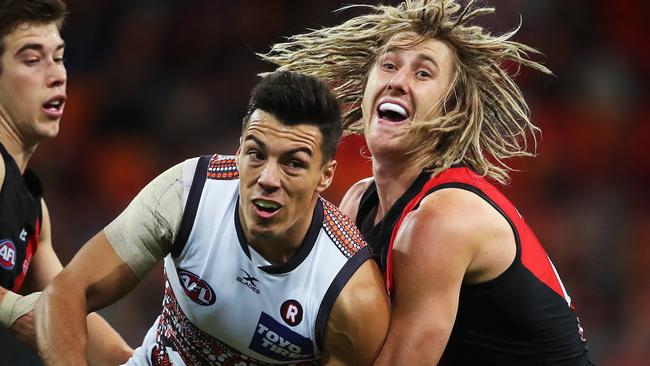 Essendon stars Zach Merrett (left) and Dyson Heppell hope to call Dylan Shiel a teammate next year. Picture. Phil Hillyard