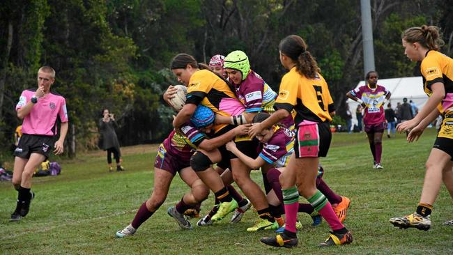 HARD HIT: Pania Cash from the Outback Queensland rugby league side goes in hard for the tackle. Picture: Hineata Cash