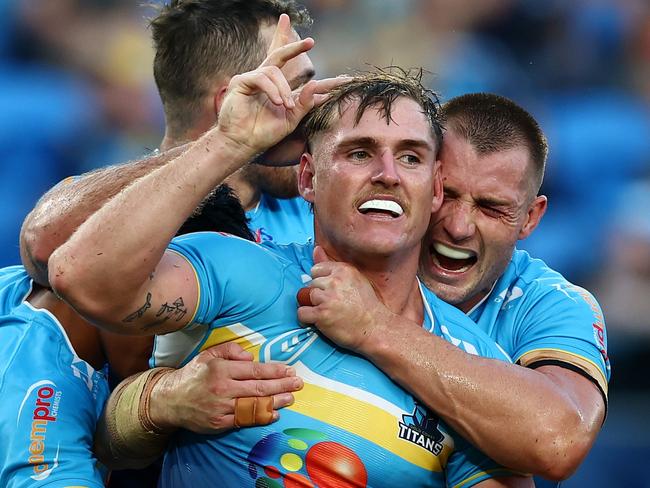 GOLD COAST, AUSTRALIA - MAY 12: AJ Brimson of the Titans celebrates a try during the round 10 NRL match between Gold Coast Titans and North Queensland Cowboys at Cbus Super Stadium, on May 12, 2024, in Gold Coast, Australia. (Photo by Chris Hyde/Getty Images)