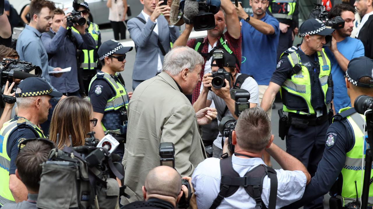 Cardinal George Pell walks along a street in Melbourne this morning. Picture: Con Chronis/AFP