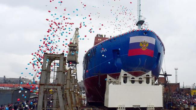 People attend the float out ceremony of the nuclear-powered icebreaker 