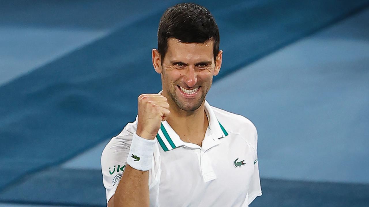 Serbia's Novak Djokovic celebrates beating Russia's Aslan Karatsev.