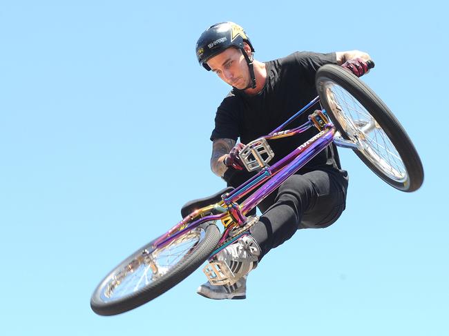 Freestyle BMX star Logan Martin does some tricks for the camera at the BMX centre in Archerfield. Logan Martin is Australia's big medal hope when the sport makes its Olympic debut in Tokyo. Thursday October 26, 2017.  (AAP image, John Gass)