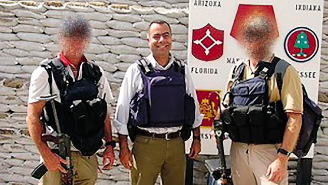 Nick Kaldas from his March 2025 memoir Behind the Badge, published by HarperCollins, in Iraq with two members of his protection team.